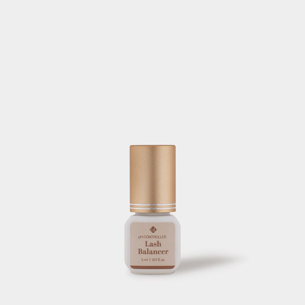 BL Lashes Lash Balancer pH Controller in a small frosted glass bottle with a metallic gold cap, displayed on a light gray background. The beige label reads “pH Controller Lash Balancer” with the volume “5 ml / 0.17 fl. oz.” A soft shadow falls to the right, emphasizing a clean, minimal studio-style presentation that highlights the compact professional product designed for pH balancing during eyelash extension preparation and lash treatment procedures.